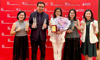 HKHS Social and Elderly Wellness Director Dr Carmen Ng (centre), together with the team,  received the awards in Singapore on behalf of HKHS. 